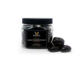 Jar of Grand Marnier Pecans with a black lid on a white background dark chocolate