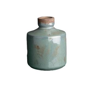 A grey blue bottle-shaped vase isolated on a white background.