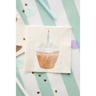 Napkin with a cupcake design featuring a candle on a striped background