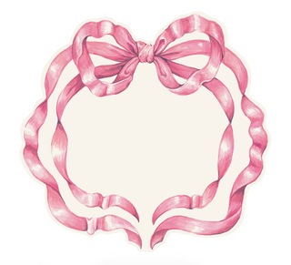 A die-cut pink bow placemat laid out on a white background, designed to resemble a bow shape with pink tones and a white center. Hester & Cook Die-Cut Pink Bow Placemats