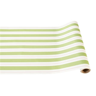 A rolled up green and pink striped paper table runner. Hester & Cook Green & Pink Awning Stripe Runner