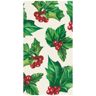 Pattern of green holly leaves and red berries on a guest towel on a white background. Hester & Cook Holly Guest Napkins