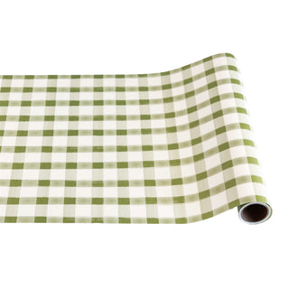Roll of green and white checkered paper table runner on a white background. Hester & Cook Moss Painted Check Runner
