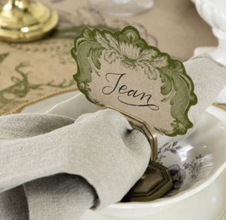 Gold napkin ring with a place card holder and inserted napkin