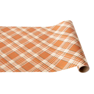 Roll of orange and beige plaid paper table runner on a white background.Hester & Cook Orange Plaid Runner