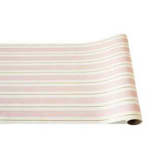 A rolled-up paper table runner with pink and gold horizontal stripes on a white background.