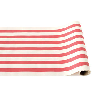 A rolled up red and white striped paper table runner. Hester & Cook Red Classic Stripe Runner