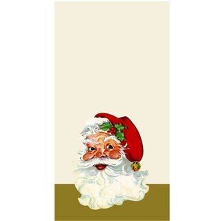 A paper napkin with a printed illustration of Santa Claus wearing a red hat and a Christmas-themed decoration. Hester & Cook Santa Guest Napkins