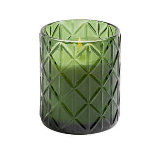 A green, geometric-patterned 15 oz candle with a visible wick and a small flame, made of soy wax.