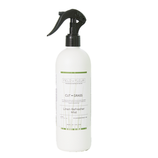 White spray bottle with black nozzle on a white background