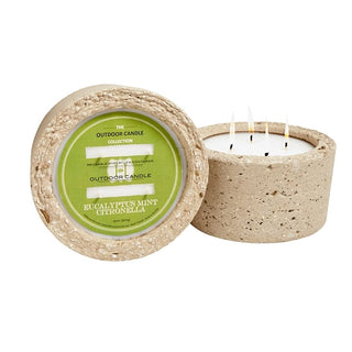 Concrete outdoor candle with a green label on a white background