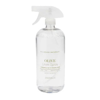 A clear plastic bottle with a white spray nozzle labeled 'OLIVE Linen Spray', with a white background, hillhouse naturals 