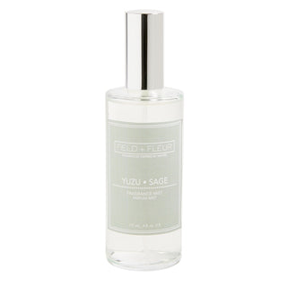 A clear glass spray bottle labeled Hillhouse Naturals Yuzu Sage Fragrance Mist.