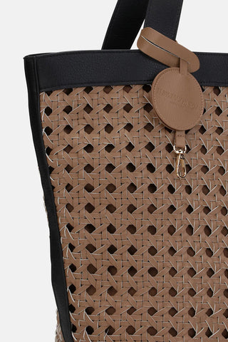 Tote bag with woven pattern and black top section on a white background