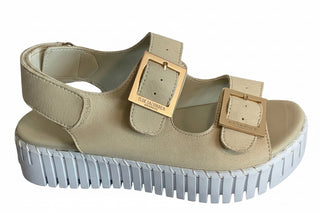Beige sandal with gold buckle and white sole