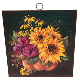 Jeweled Flower Pumpkin Large Art
painting on metal depicting a vibrant floral arrangement with yellow sunflowers, purple roses, and black-eyed flowers in a pumpkin-shaped vase against a black and green background. The painting is shown hanging from a metal ring at the top.