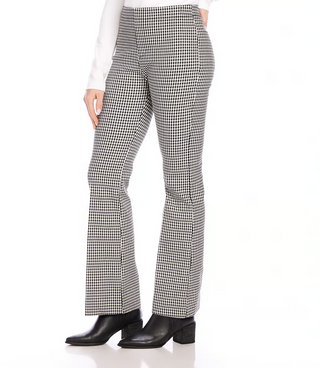 A pair of mid-rise, bootcut woven pants with a small check pattern in black and off-white, featuring a mock fly zipper and front rise.