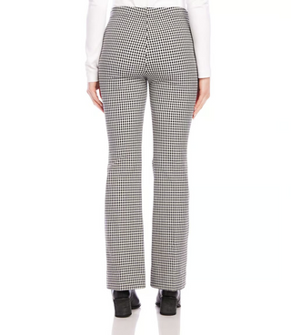 A pair of mid-rise, bootcut woven pants with a small check pattern in black and off-white, featuring a mock fly zipper and front rise.
