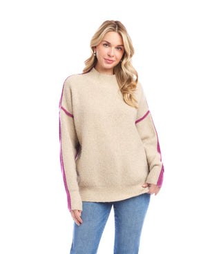 Woman wearing a beige sweater with pink accents on a white background. Karen Kane Colorblock Mock Neck Sweater, Oatmeal with Orchid