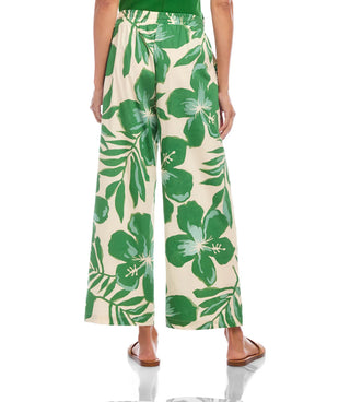 Green floral-patterned pants on a white background