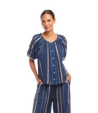 Woman wearing a blue striped outfit on a white background