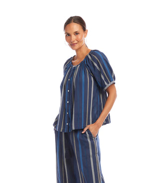 Woman wearing a blue striped outfit on a white background
