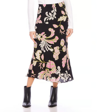A model wearing a black, pink and green floral print midi skirt.
