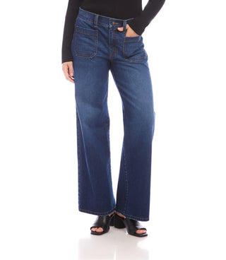 Person wearing blue jeans on a white background. Karen Kane Lauren Patch Pocket Jeans in Indigo