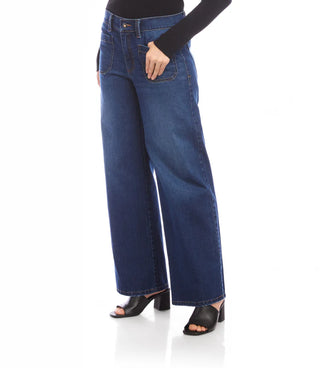 Blue jeans worn by a person on a white background. Karen Kane Lauren Patch Pocket Jeans in Indigo