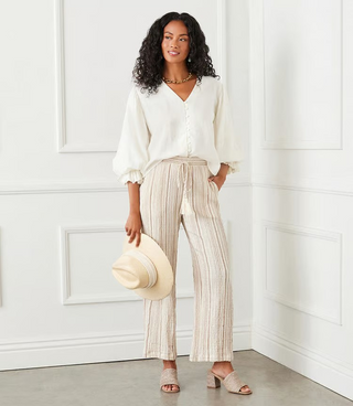 A pair of beige metallic stripe drawstring ankle pants by Karen Kane, modeled against a plain background.
