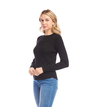 Woman wearing a black long-sleeve top and blue jeans on a white background. Karen Kane Ribbed Crewneck Sweater in Black