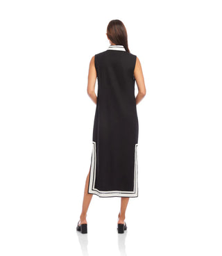 A woman models the Karen Kane St. Tropez Sleeveless Midi Dress in black with off-white contrast details.