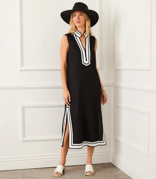 A woman models the Karen Kane St. Tropez Sleeveless Midi Dress in black with off-white contrast details.