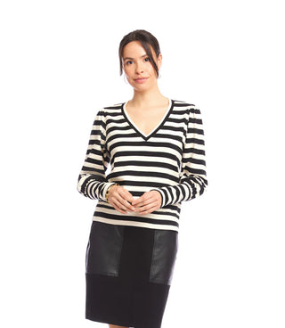 Woman wearing a black and white striped sweater with a plain background. Karen Kane V-Neck Stripe Bishop Sleeve V-Neck Top, Black with Cream