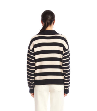 Person wearing a black and white striped sweater on a white background. Karen Kane Stripe Polo Sweater, Black with Ecru