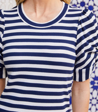 Navy and white striped shirt worn by a person