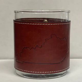 Kentucky State Shape Faux Leather Rocks Glass A faux leather rocks glass with the shape of Kentucky state outlined on the side, predominantly brown in color.