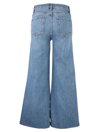 A pair of high-rise, wide-leg jeans with a raw hem.