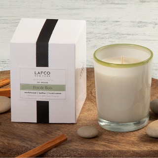 LAFCO Feu de Bois Votive candle next to the LAFCO product box