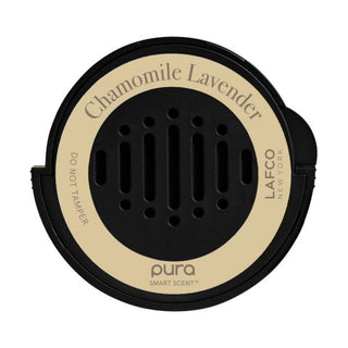 A LAFCO Pura smart diffuser car refill with chamomile lavender fragrance. The round black packaging has the brand and product name printed in white and beige tones.