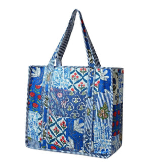 Blue patterned tote bag with floral and geometric designs on a white background. Large Blue Quilted Tote