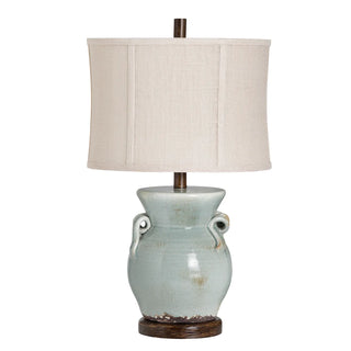 Lawson Table Lamp
A table lamp with a blue ceramic base and a beige linen shade brown