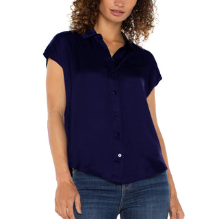 A mode wearing a Liverpool dolman, button down, short sleeve top in navy blue