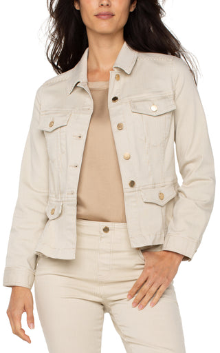 A woman wearing a beige cappuccino stripe peplum jacket with long sleeves, four front flap pockets, and a button-front closure.