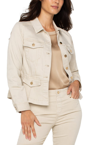A woman wearing a beige cappuccino stripe peplum jacket with long sleeves, four front flap pockets, and a button-front closure.