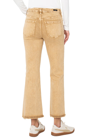 Beige jeans worn by a person on a white background