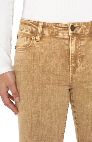 Close-up of beige pants with a white shirt underneath on a white background