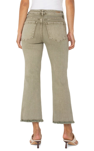A pair of cropped flare jeans with fray hem in an olive green color.