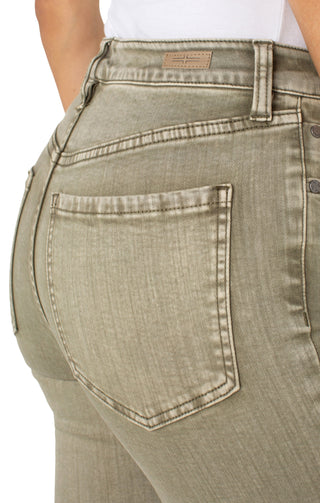 A pair of cropped flare jeans with fray hem in an olive green color.