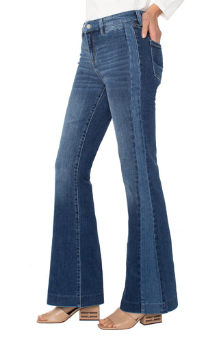 Liverpool Hannah Flare Blue jeans worn by a person on a white background. Liverpool Hannah Flare with Blocking Details, Ridgely